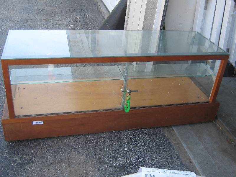 lot 7144 image: Wood and Glass counter top display case, sliding glass doors, lock with 2 keys