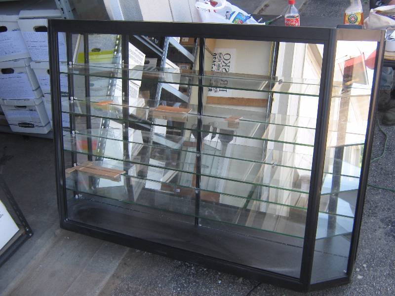 lot 7146 image: Lighted Wall Mount Counter top Display Cabinet, glass shelves, open front hardware and instructions included 5 x 10 x 40 tall