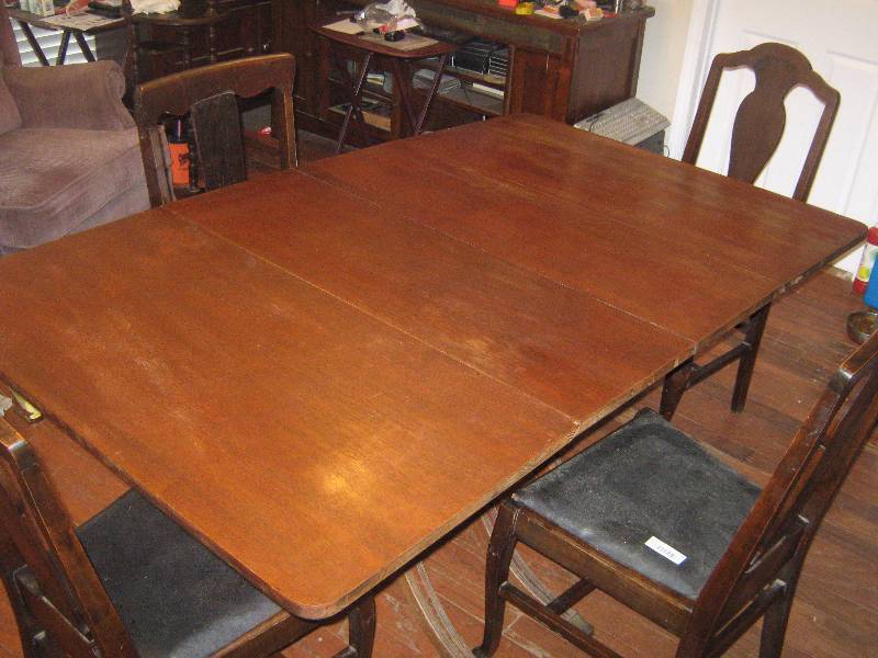 lot 7214 image: Vintage Wooden Drop Leaf Table with 4 wooden chairs, includes 3 extra leaves