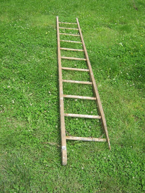 lot 7235 image: Large vintage  Wooden Ladder 12 ft. tall, pulley mounted to top rung