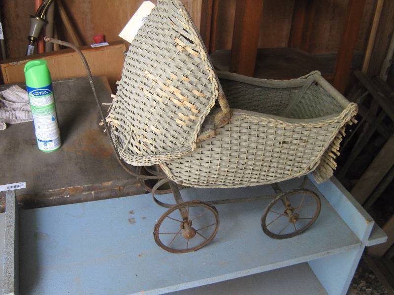 lot 7238 image: Creepy Wicker and Metal Doll Carriage