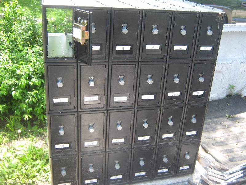lot 7270 image: Inwall mount cell phone cabinet, combinations on the inside of the doors 24 bins
