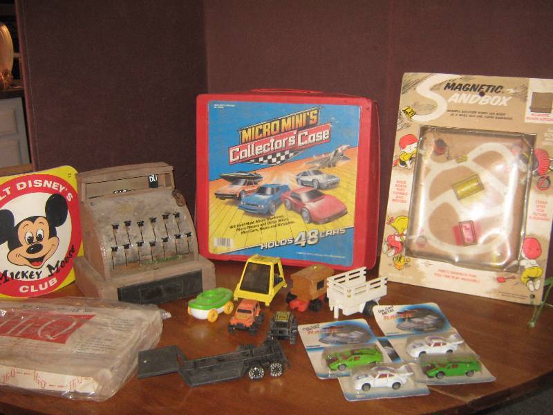 lot 7294 image: large lot of toys, Mickey Mouse Club Book, Metal cash register, Cars, football kicker, Car Carrier, other