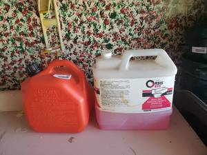 lot 3869 image: Heavy duty bathroom cleaner and gas can