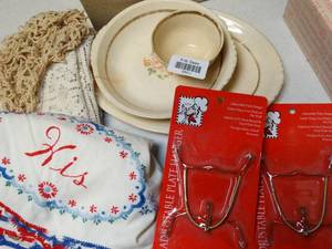 lot 37011 image: One place setting of karat gold trimmed dish-ware and Hangers - Needlework