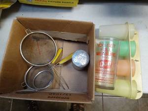 lot 37029 image: Vintage Kitchen Stuff Set of Yellow Handle Mesh Strainers and Vintage New Stock Tupperware Cups with Wall Holder