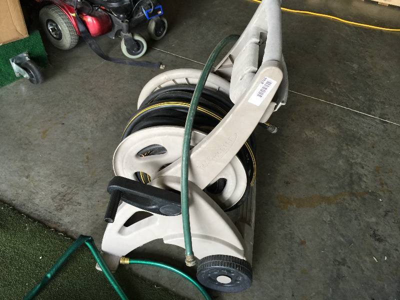 lot 8744 image: WATER HOSE WINDER RETRACTOR & 3 WATER HOSES