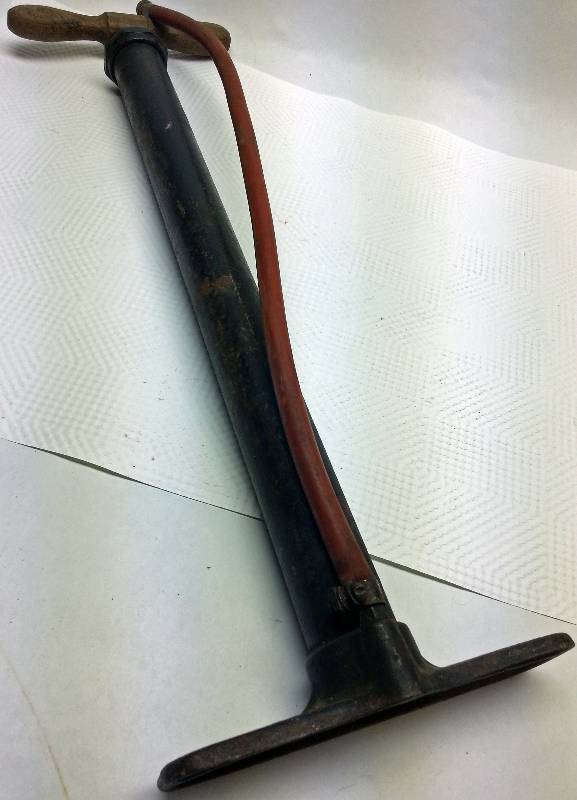 lot 1730 image: Antique hand operated tire pump.  Not for the light weights  It will need a seal replaced to really pump some air.