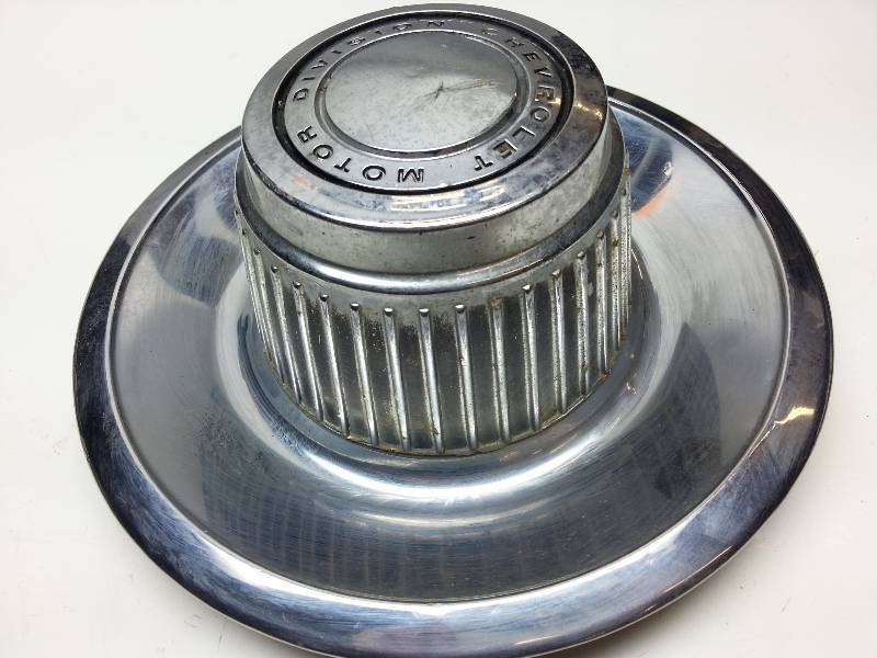 lot 9003 image: Impala Camaro Corvette Nova rally wheel derby center cap.   If youre restoring to pristine, this is NOT the one you want.