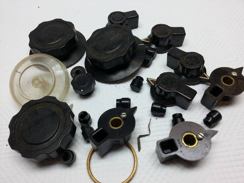 lot 1738 image: Misc Bakelite switch dials from a tinkerers garage work shop.
