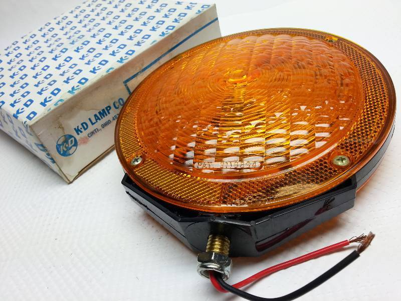 lot 9180-2 image: New in the box K-D Lamp 874-2101 double sided amber 7 inch diameter truck or school bus fender or top mounted turn signal light