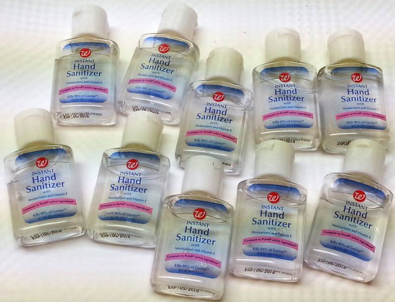 lot 9149 image: 10 small purse bottles of Walgreens hand sanitizer Moisturizer & Vitamin E