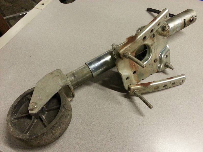 lot 1828 image: Clamp on or bolt on trailer jack assembly with spring loaded latch to swing it up out of the way.
