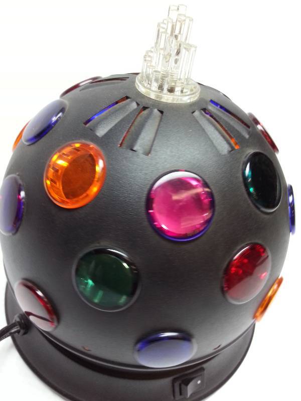 lot 1832 image: 8 inch disco colored globe lens fun light.  Hang it from the ceiling or set it on the table.  It definitely casts some wild effects