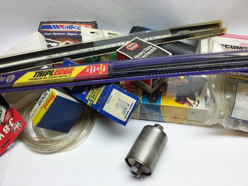 lot 1836 image: Box of auto parts most are new some are used.  Put it on the shelf so you have it when you need it.