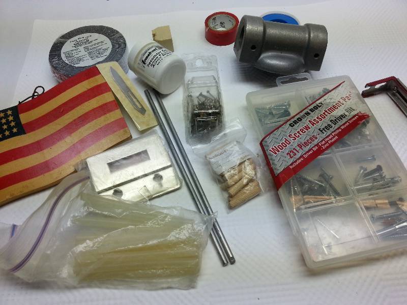 lot 1839 image: A real menagerie of pieces in this box including a big filter mounting bracket and the American flag