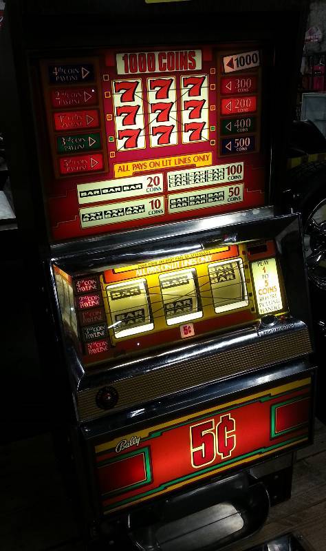 lot 1811 image: Out of the same barn the motor bike was found.  Bally Nickel slot machine.  Cant make it do much except light a few lights.