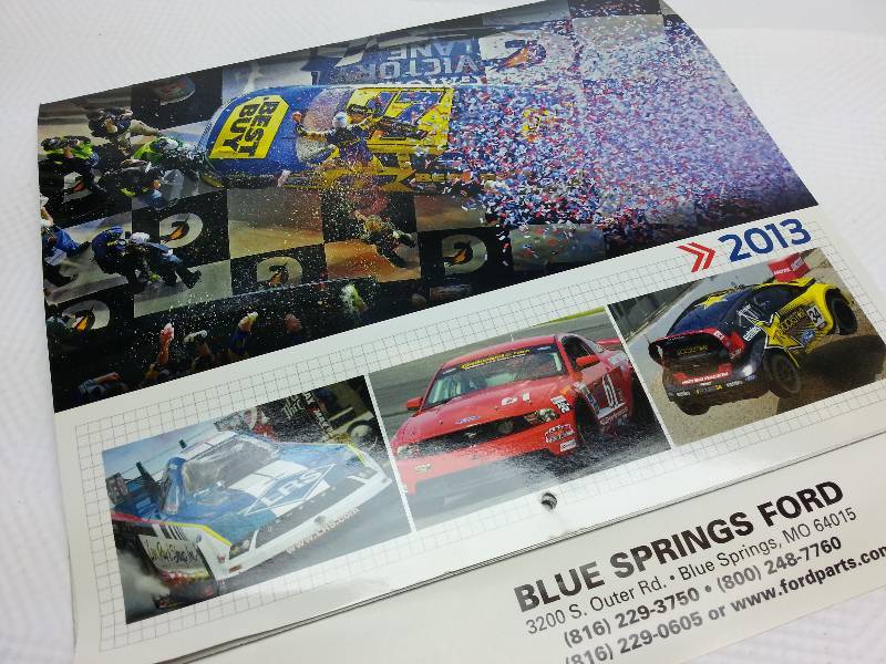 lot 1841 image: Photos are suitable for framing by cutting off the bottom of this 2013 Ford Dealership racing calendar
