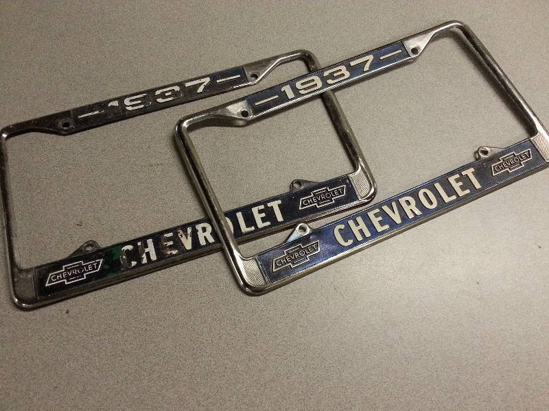 lot 3004 image: A pair of Vintage 1937 Chevrolet license plate chrome frames front and rear or garage art