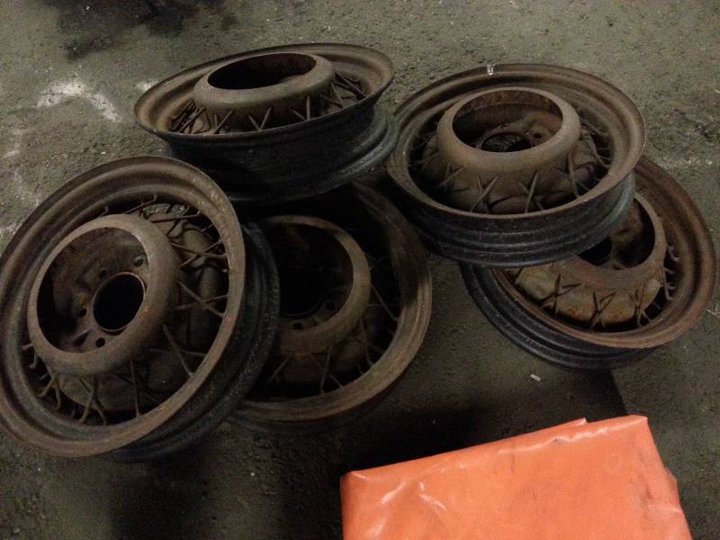 lot 3019 image: Complete set of 4 and a spare Chevy 6 lug on 5-12 bolt pattern 17 wire spoke wheels.