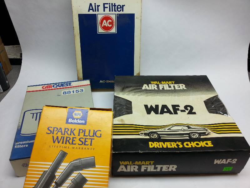 lot 1848 image: 3 new replacement automotive air cleaner elements and a new set of 4 cylinder NAPA spark plug wires.
