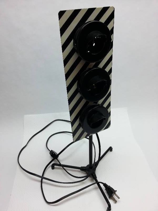 lot 1864 image: Table top Stop Amber or Go decorative light with tripod stand.  I plugged it in and got nothing.