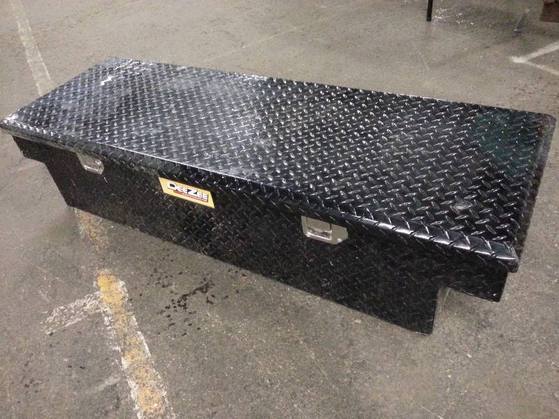 lot 1865 image: Black DeeZee treadbrite aluminum pick up truck tool box.  In nice condition but has been on a Heavy Equipment service truck