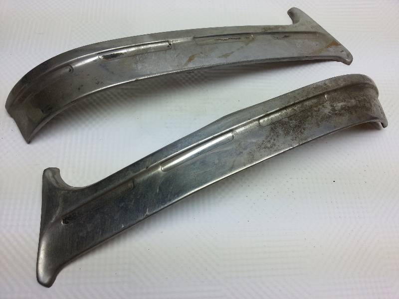 lot 1872 image: I believe this pair of stainless trim pieces are upper quarter molding piece for both sides of the 1955 Chevy