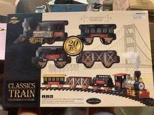 lot 66985 image: Kids- Classic Christmas Train Set Battery Powered Engine Light Sound Smoke Play Set