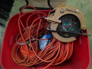 lot 37463 image: Black and Decker Saw  Extention Cords Lot  Wheel and Chemicals