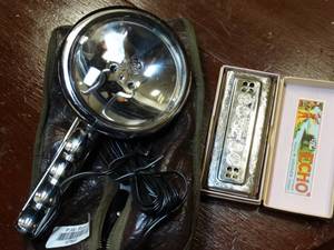 lot 37563 image: Handheld Light with Echo Bell Metal Reed Harmonica