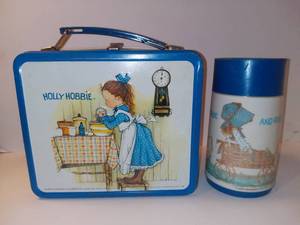 lot 3046 image: Holly Hobbie Lunchbox With Thermos - Girl Baking