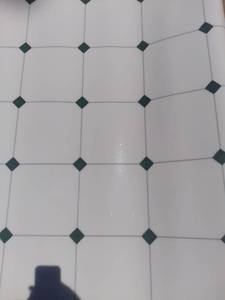 lot 130 image: 12 x 17 Foot Piece of Linoleum - Diamond and Square Pattern