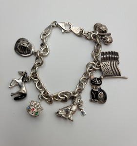 lot 134 image: 925 Bracelet with Sterling & 925 Charms - 29.3g