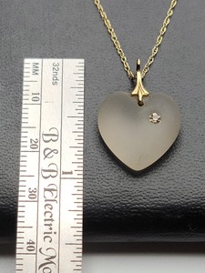 lot 136 image: 10k Yellow Gold Chain with Frosted Glass Pendant