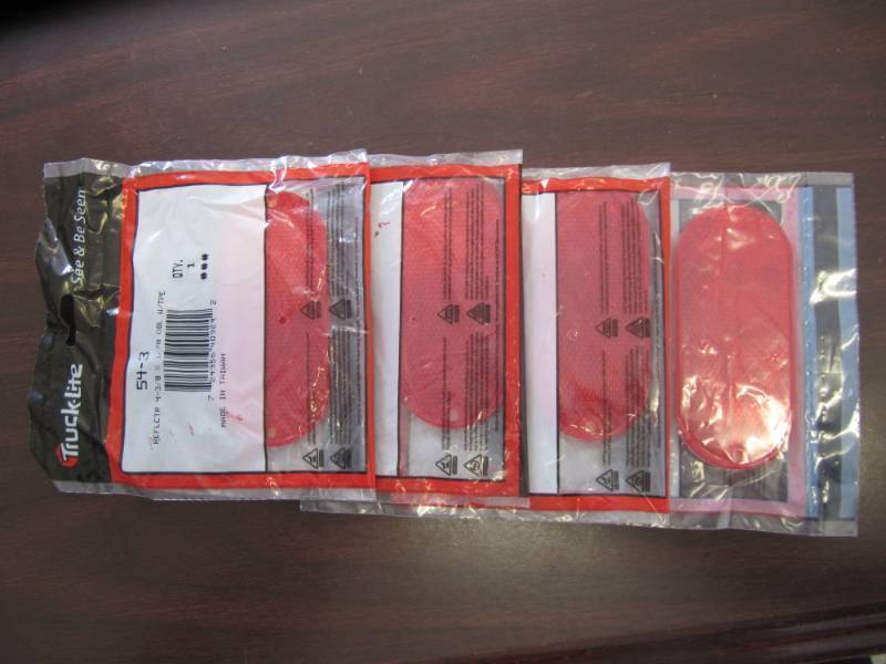 lot 1661 image: 4 NEW Truck-lite Red Oblong reflector lights with tape #54-3