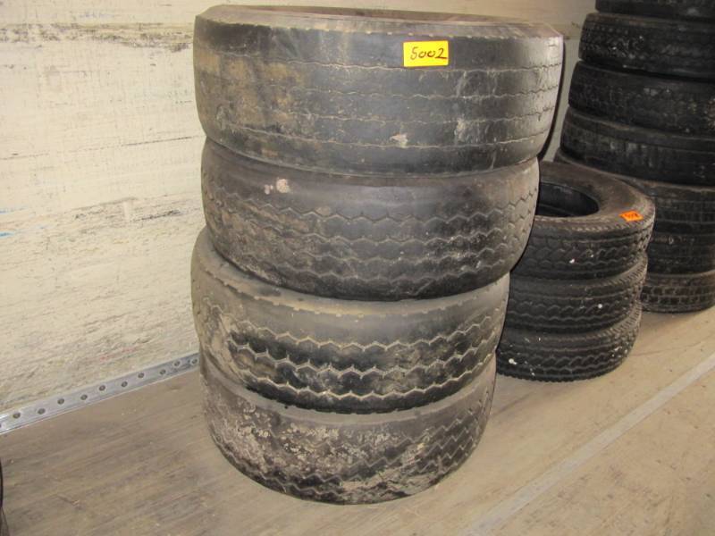 lot 5002 image: Lot of 4 425x65Rx22.5 Used Tires , Mainly used on Heavy Spec Trucks with Heavy Front Ales , Dump Trucks , Crane Trucks, Concrete Trucks Etc.