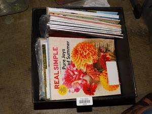 lot 23239 image: Large metal planter filled with magazines (Threads, Real Simple & Food  Cooking)