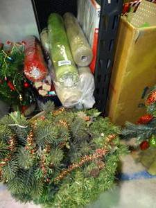 lot 23941 image: Small Artificial Christmas Tree with Rolls of Festive Fabric