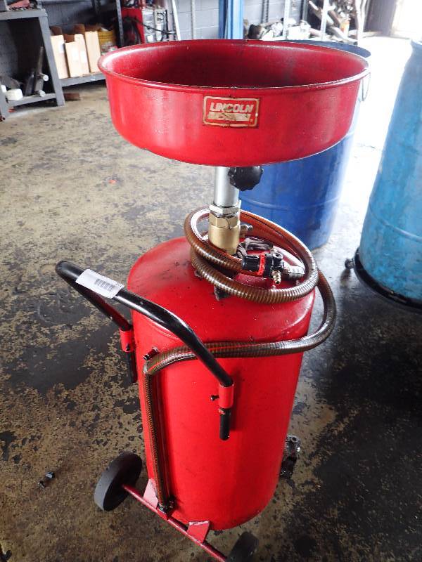 lot 121 image: Lincoln Oil Change Buggy Tank On Casters