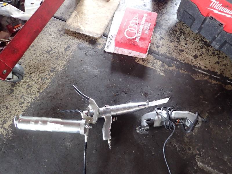 lot 130 image: Automotive Grease Gun w Dremel Tool And Air Saw Zall