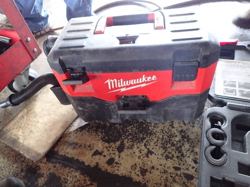 lot 131 image: Milwaukee Vac Box  w Torque Keys and Partial Control Arm Bushing Set