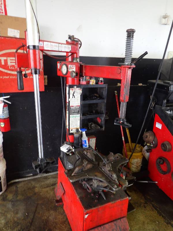 lot 172 image: Automotive Tire Machine w Wall Mounted Storage Box