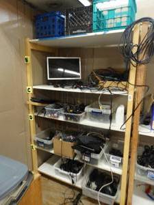 lot 21664 image: Shelf with Assorted ElectronicsCords