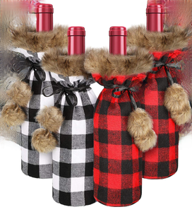 lot 5482 image: Lot of 4 Christmas Buffalo Plaid Wine Bottle Covers with Faux Fur Accents (2) Red & Black, (2) Black & White  Bonus (15) 1.5 X-Mas Magnets