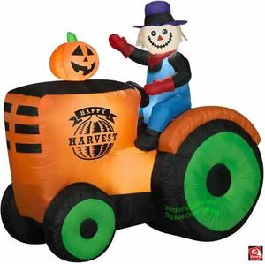 lot 8170 image: Gemmy 6 Airblown Inflatable Harvest Hayride Scarecrow On Tractor