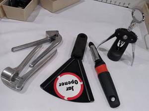 lot 1049 image: Bottle and Jar Openers with Potato Peeler and Garlic Presses