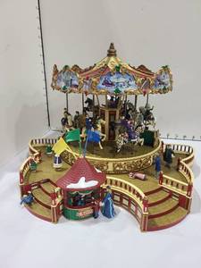 lot 1406 image: Mr. Christmas Holiday Around the Carousel Plays 30 Great Songs (One railing piece missing)