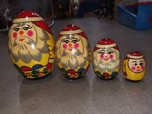 lot 1424 image: Hand Painted Santa Claus Nesting Dolls