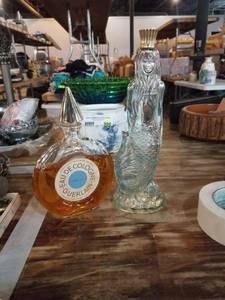 lot 909 image: cologne and mermaid bottle